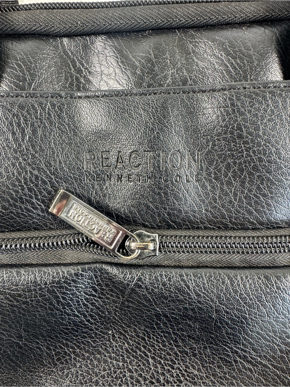 Kenneth Cole Reaction Black Leather Men's Backpack with Branded Zip Pull